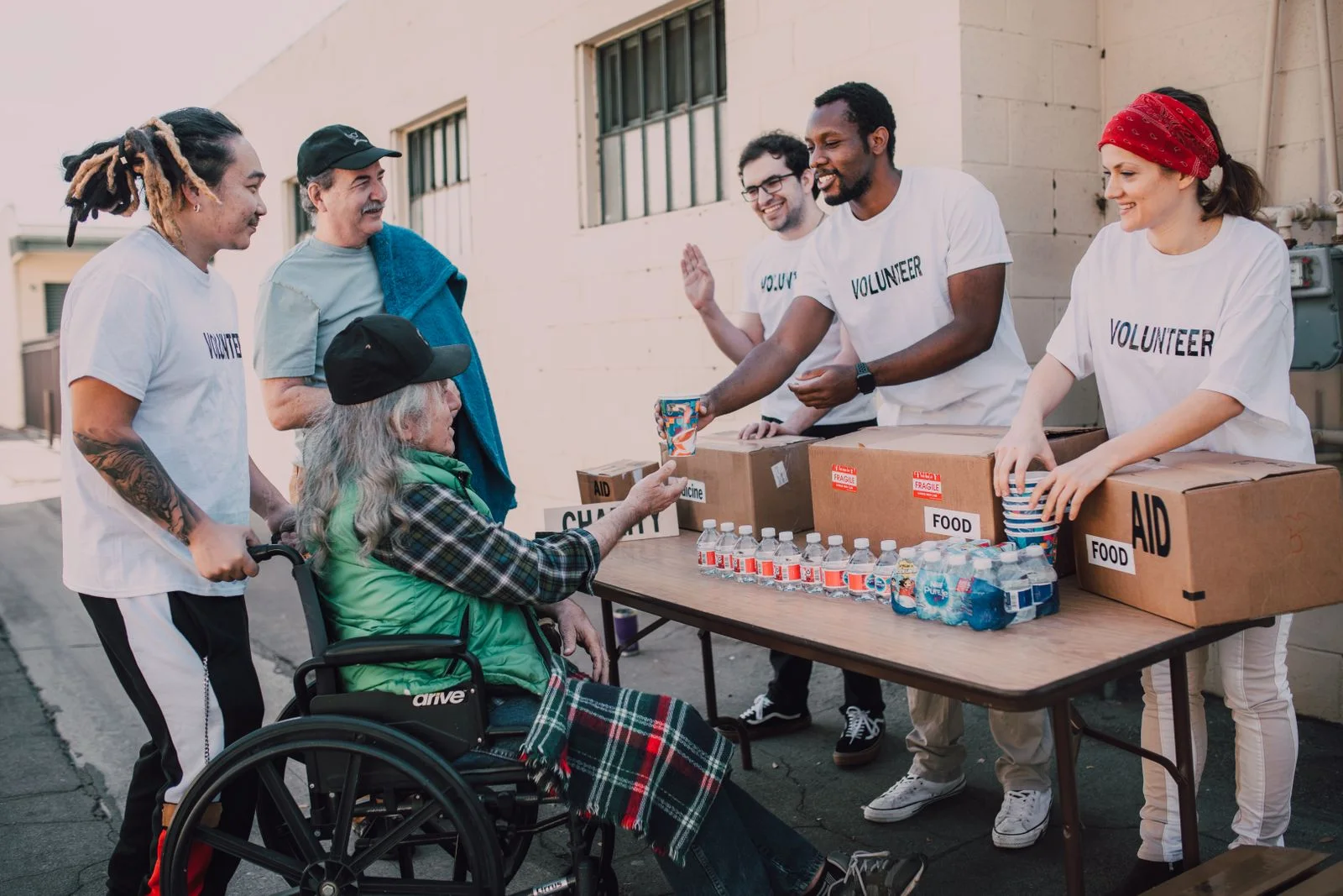 Volunteers sharing supplies at a community table